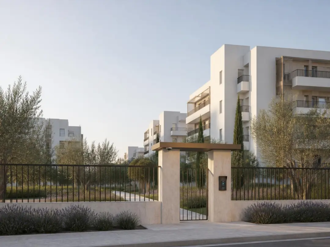 White blocks and the site entrance in evening light.